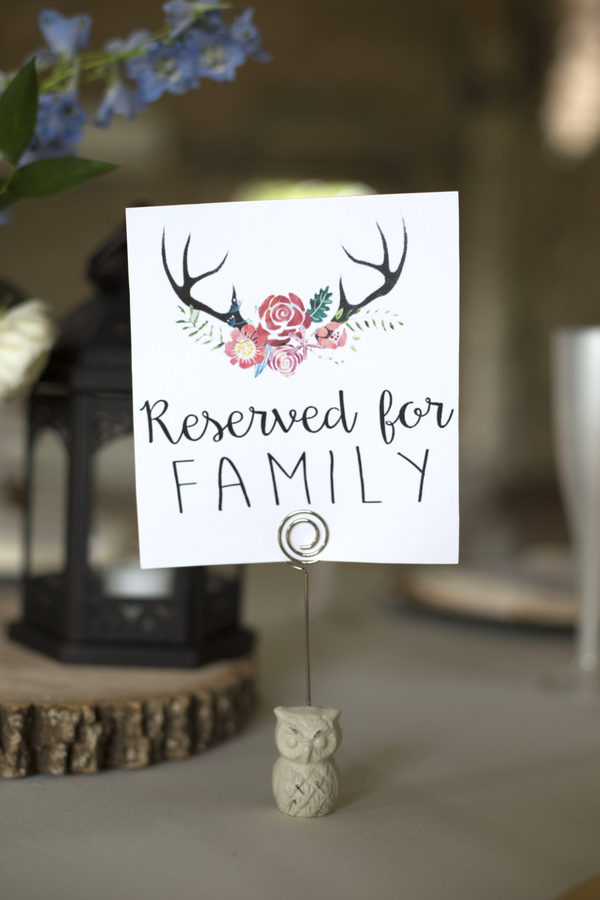 The coupled used a cute logo with antlers and flowers for their country chic wedding.