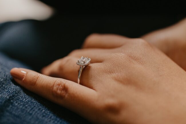 silver-colored solitaire ring