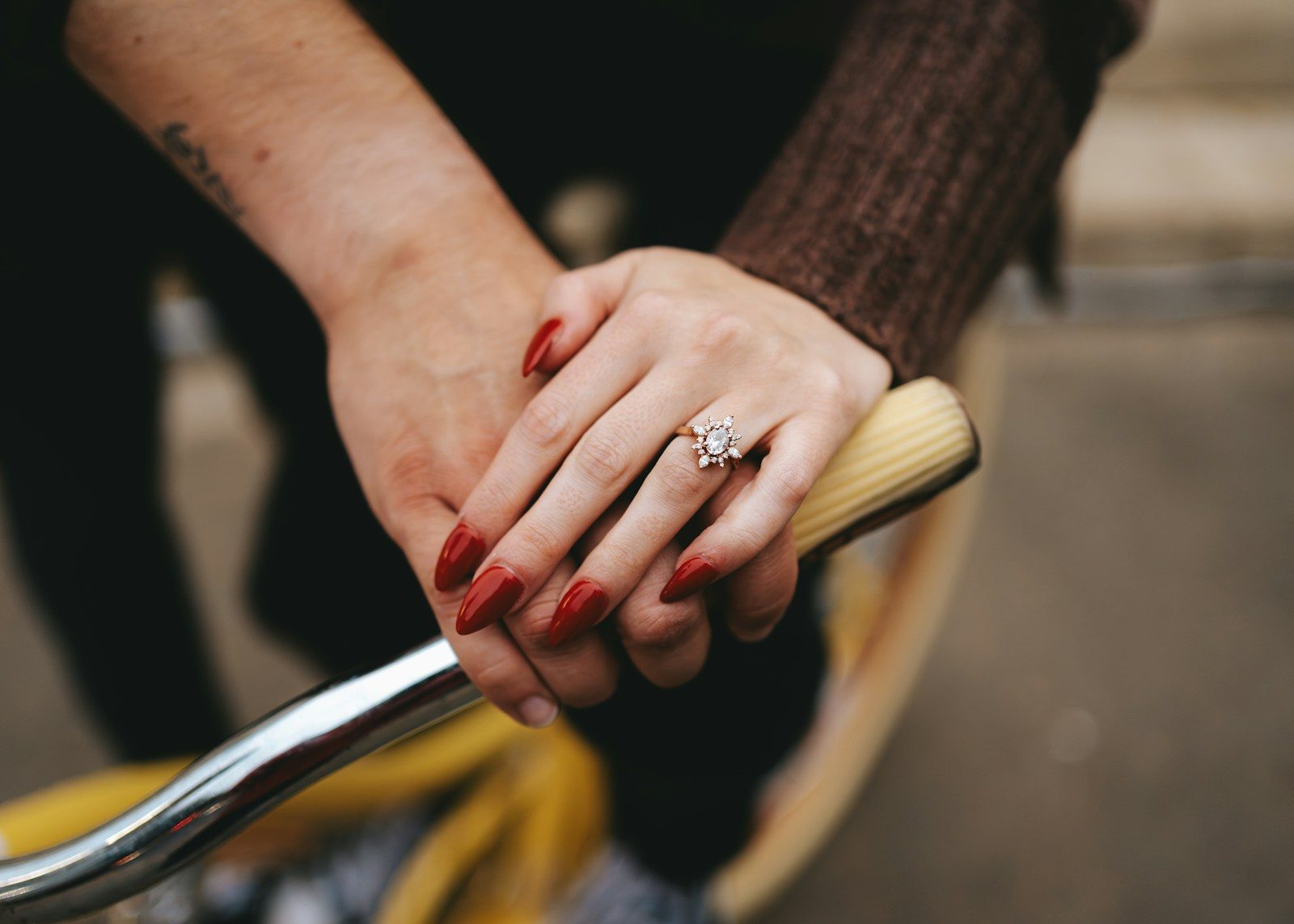 a close up of a person holding a bike handle