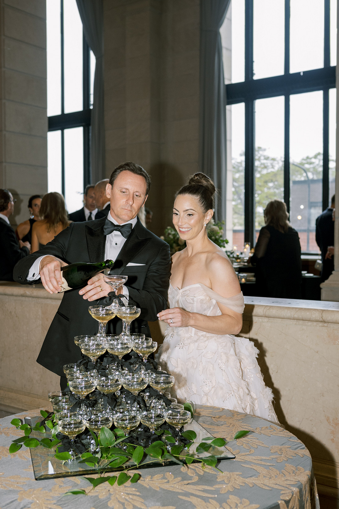Bride and groom pouring a champagne tower