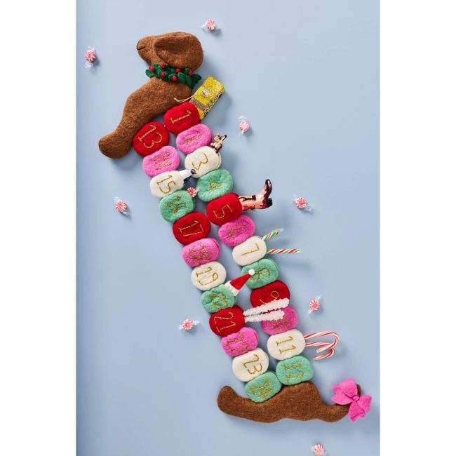Anthropologie felted wool dachshund advent calendar with colorful numbered pockets along its body