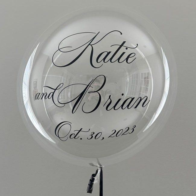 Balloominique clear bubble balloon with Katie and Brian and a date in black script