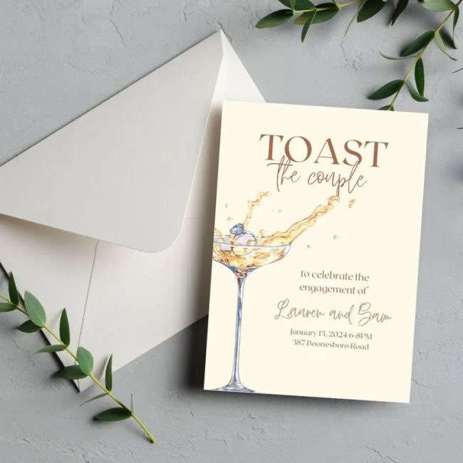 CaliGPrints Toast the Couple invitation with a watercolor champagne glass, beside an envelope