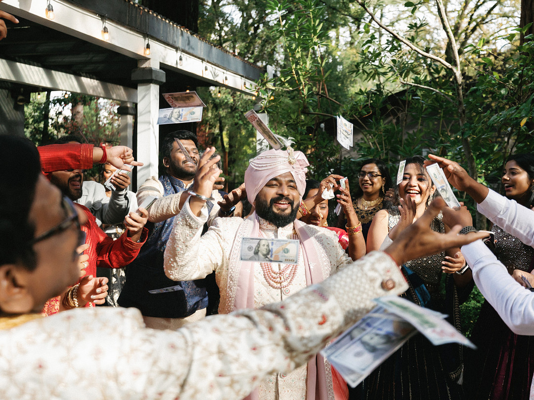 Guests dancing as the groom arrives at Deer Park Villa