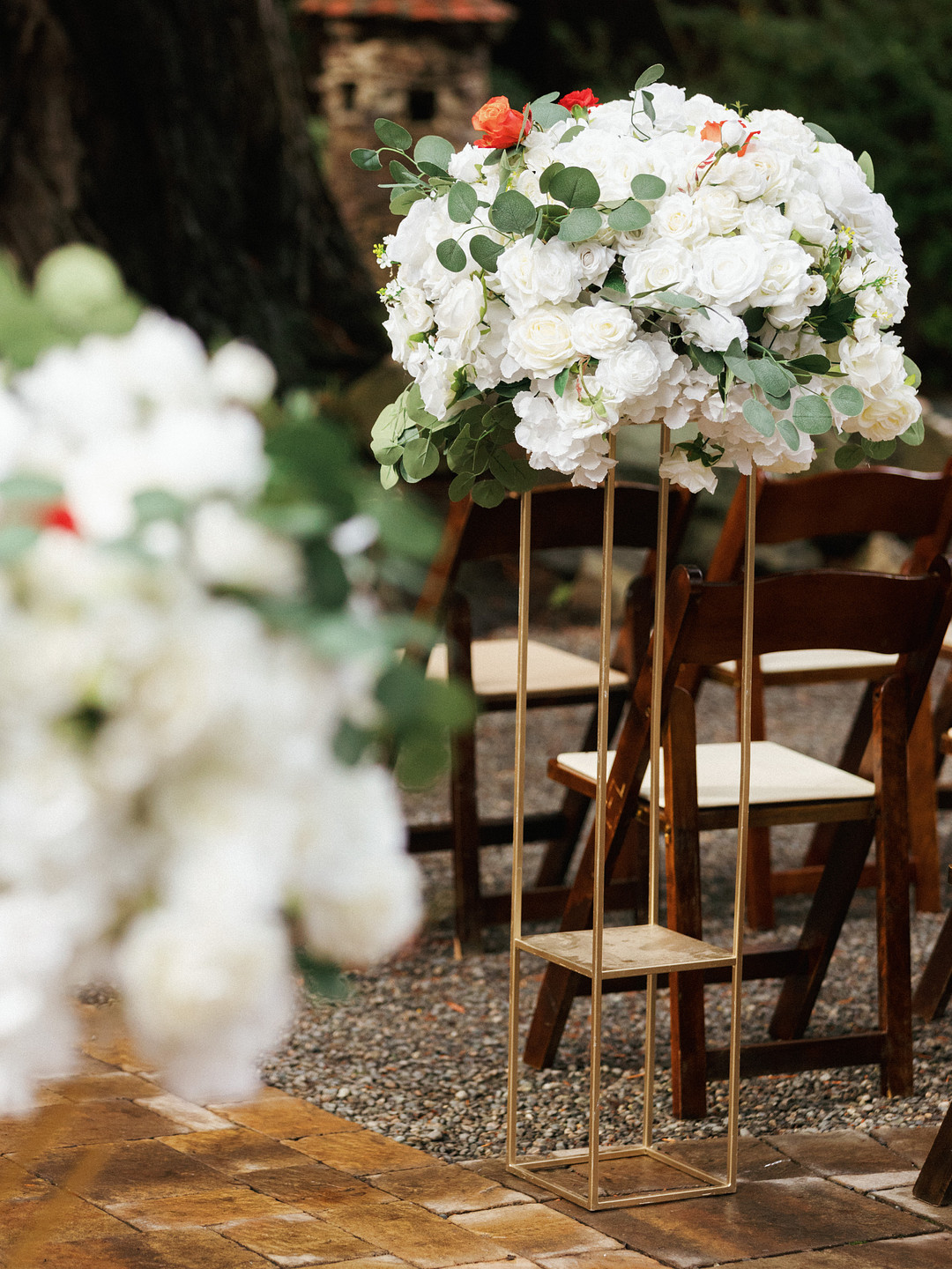 White floral arrangements in the garden at Deer Park Villa