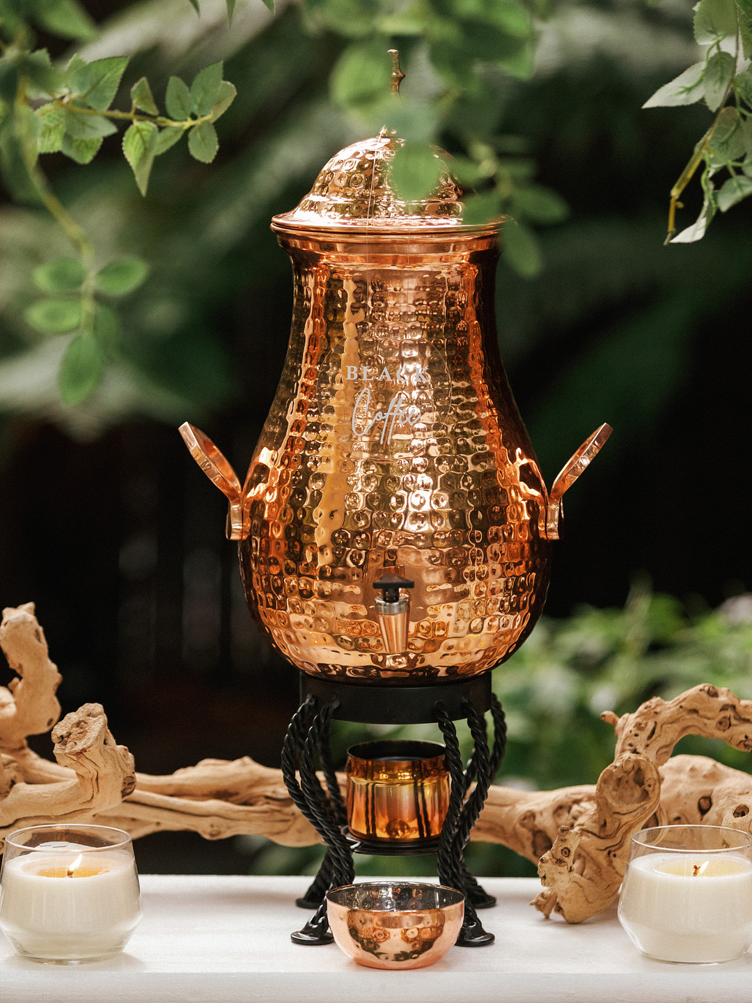 Copper beverage dispenser on the food table