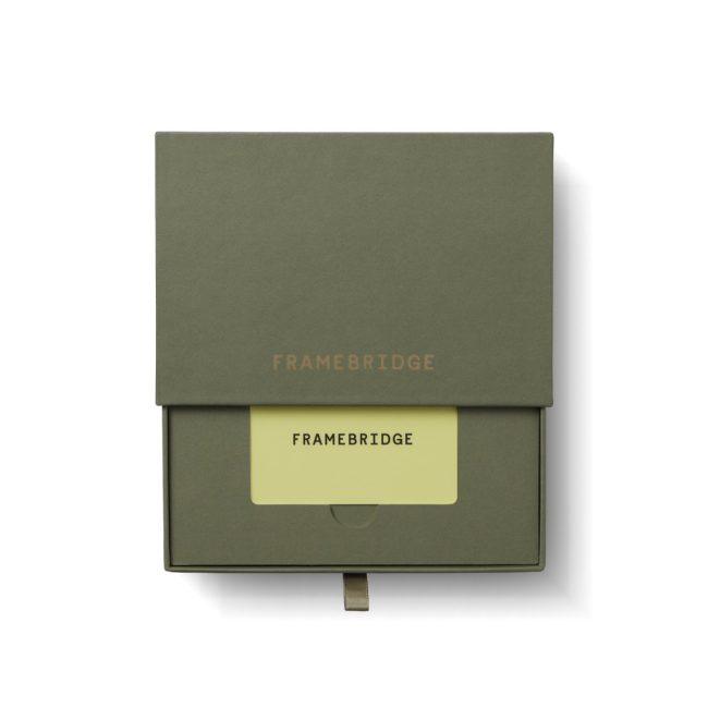 Framebridge gift card in an olive green box with a slot for the card