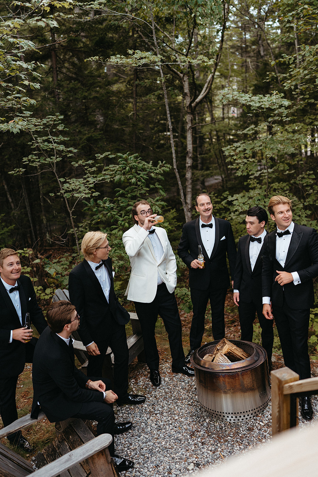 Groom with his groomsmen among the trees at Glidden Point Oyster Farms