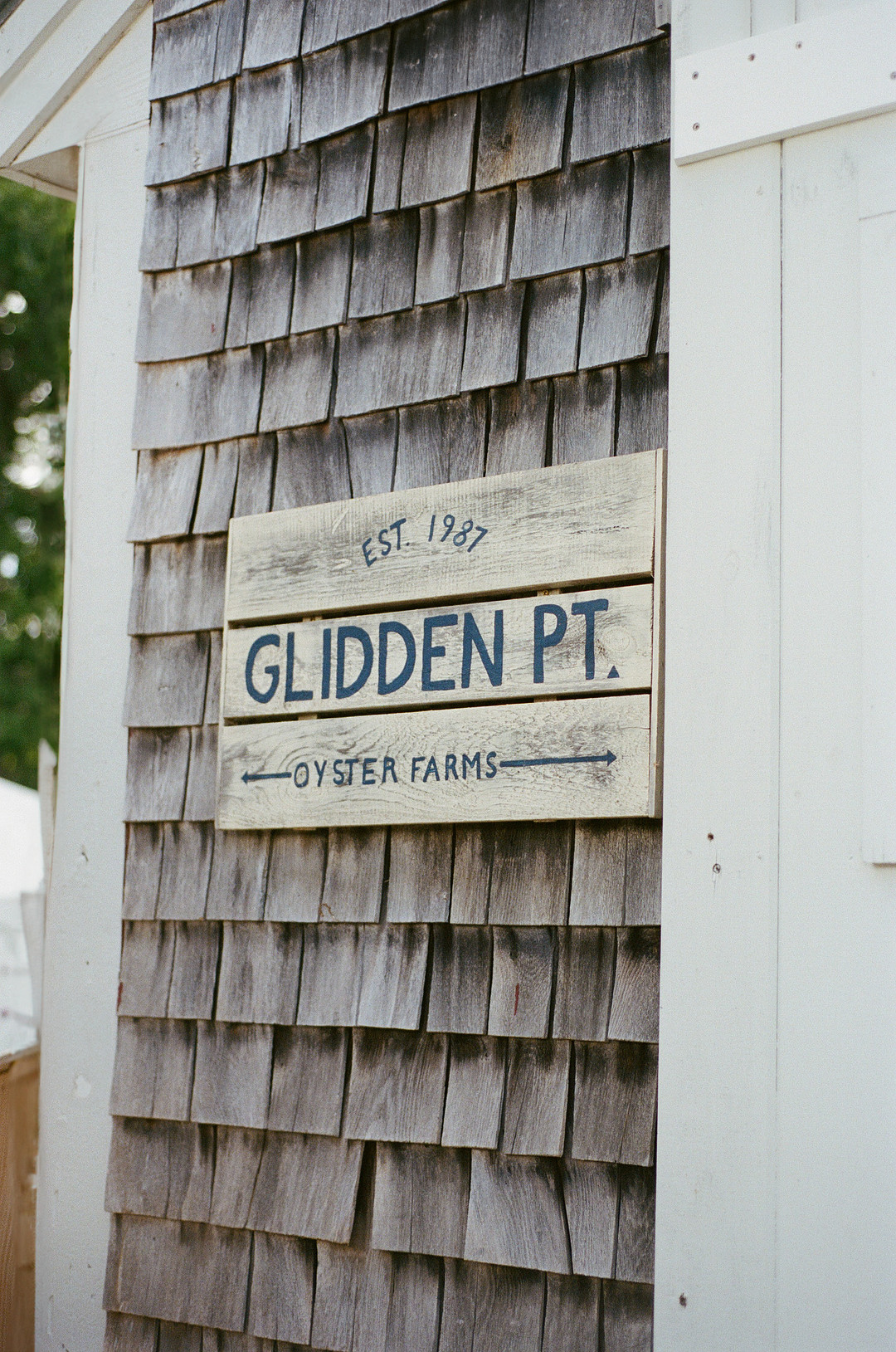 Glidden Pt. sign on a cedar-shingled shed in Edgecomb, Maine
