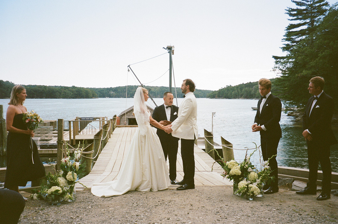 Wedding ceremony on the dock overlooking the Damariscotta River