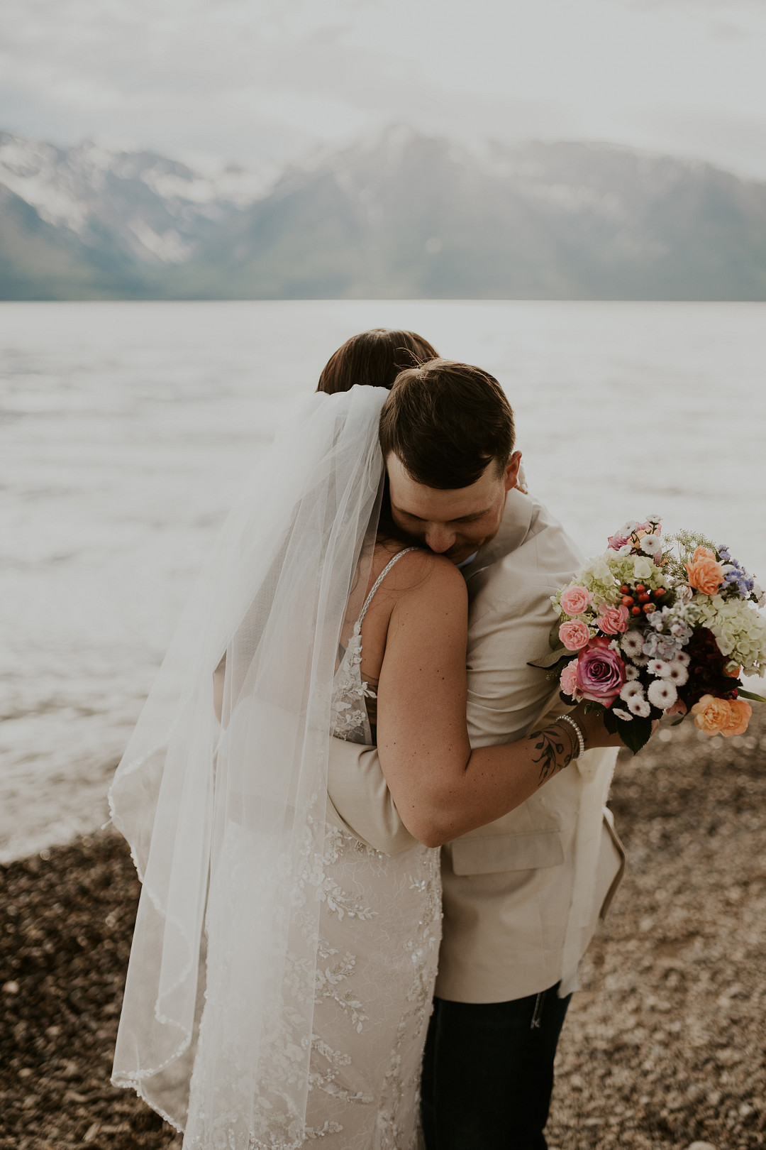Bride and groom hugging after their vows