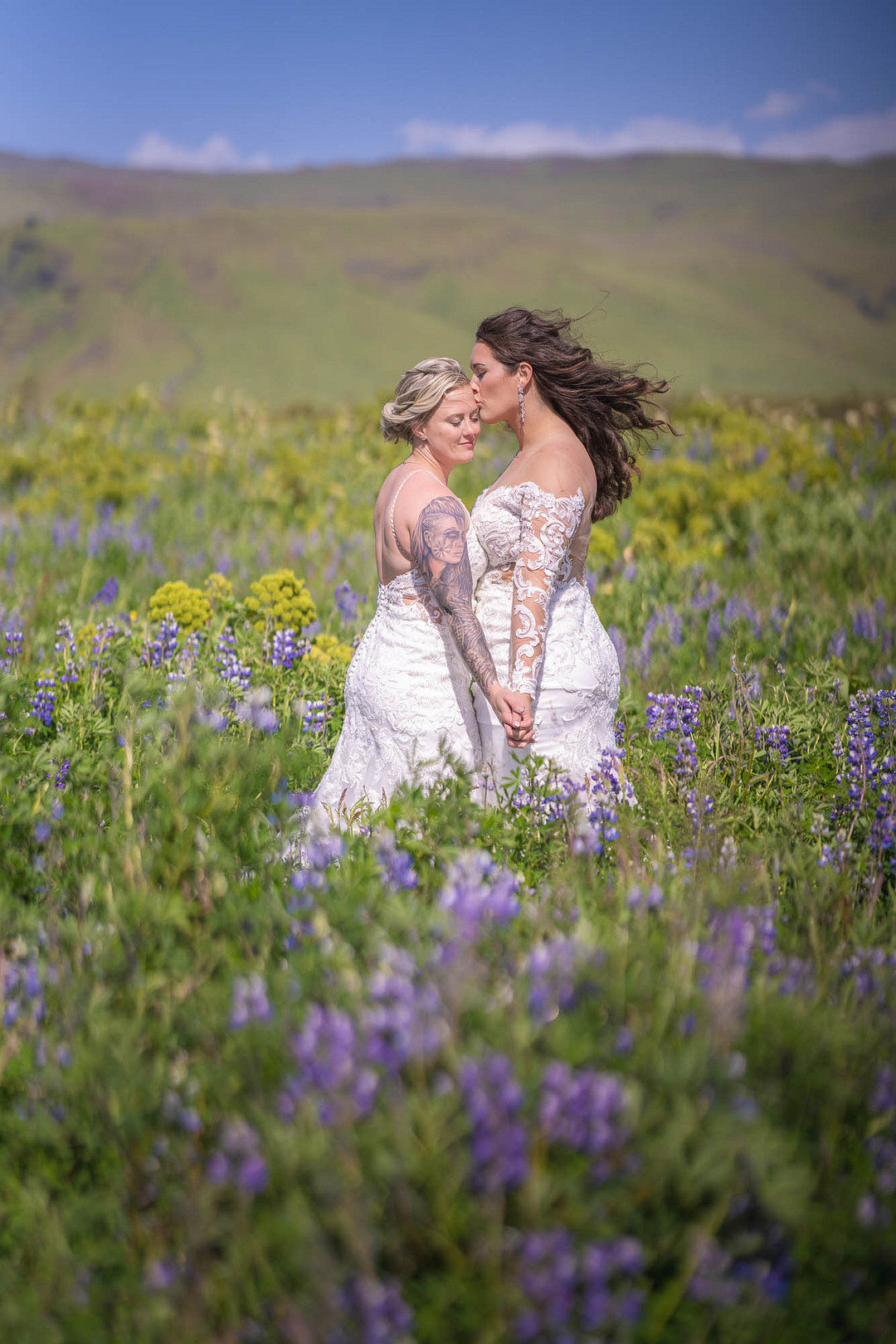 The couple in a field of purple lupines
