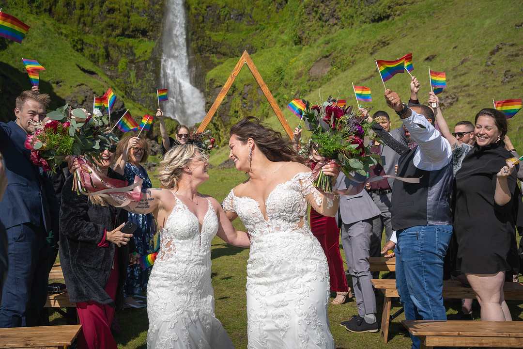 Guests cheering as the couple celebrates after the ceremony