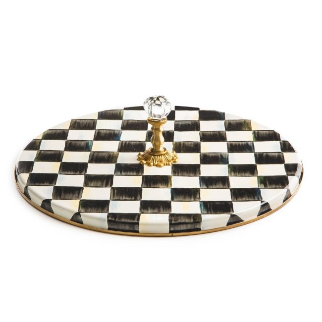 MacKenzie-Childs Courtly Check cheese course, a round black and white checked enamel tray with a gold center handle and clear glass knob