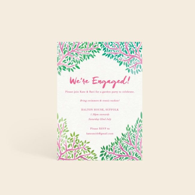Papier Pink Branches invitation with a green and pink floral border and We're Engaged in pink
