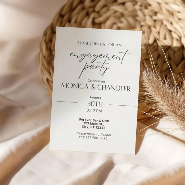 PrintablesByTaylorCo printed minimalist engagement party invitation in black script on cream