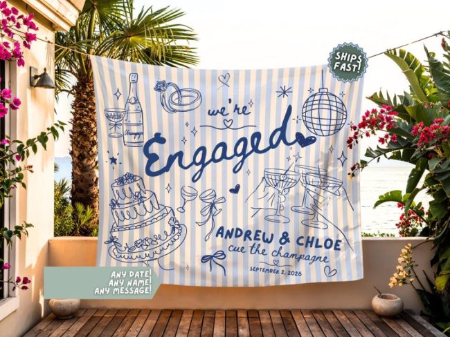Project Love Life blue and white striped banner reading We're Engaged with names and hand-drawn party doodles, hung on a patio