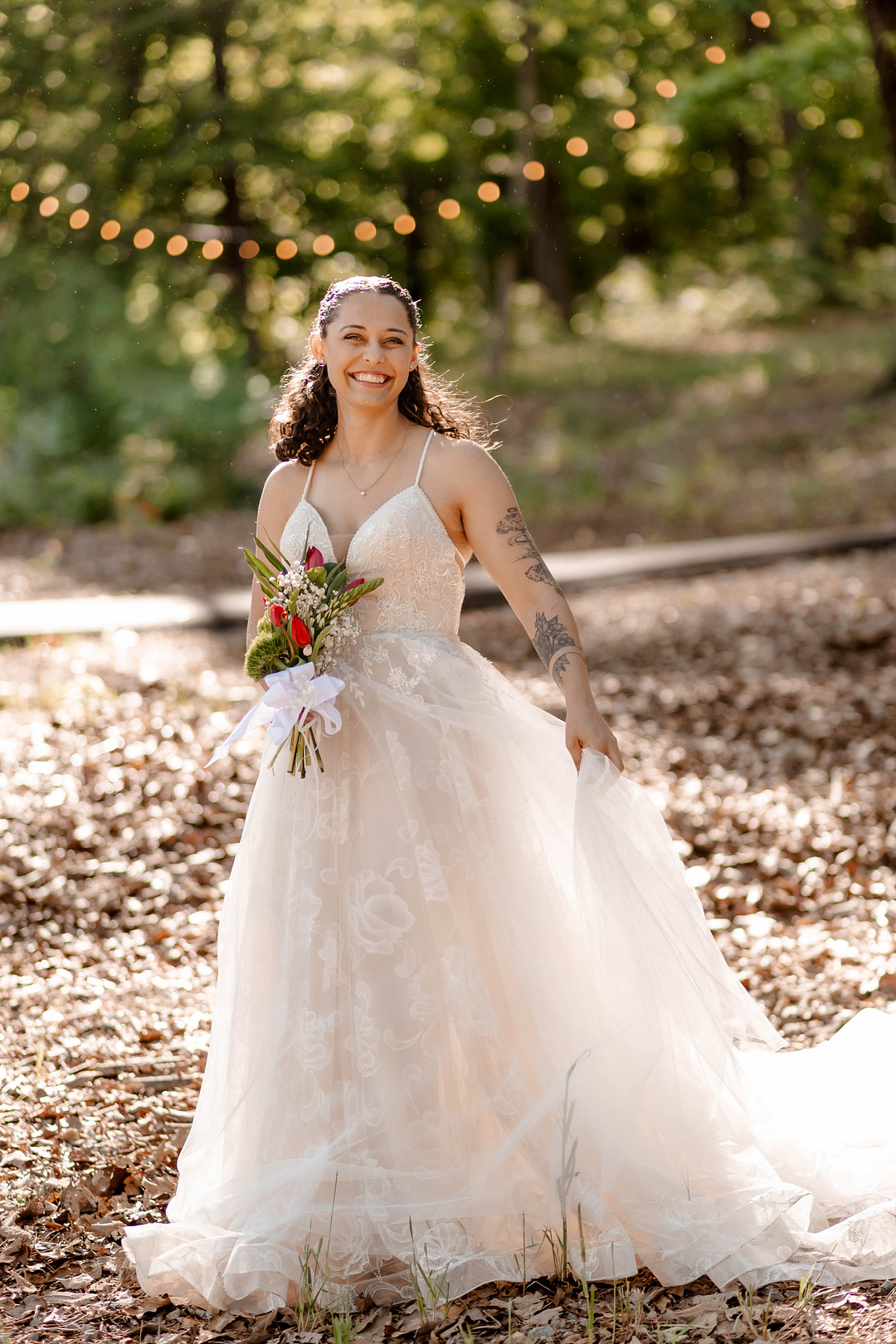 Bride in a strapless tulle gown in the forest at ReTreet