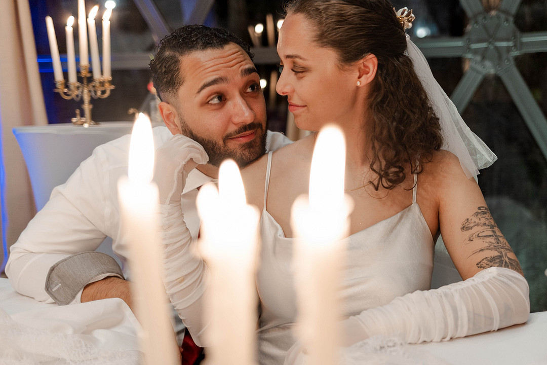 Bride and groom sharing a moment by candlelight in the Star Dome