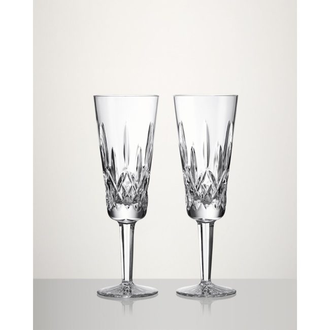 Pair of Waterford Lismore crystal champagne flutes with diamond-cut bowls